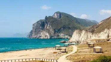 Dahariz Beach Salalah golden sand and palm-lined shoreline
