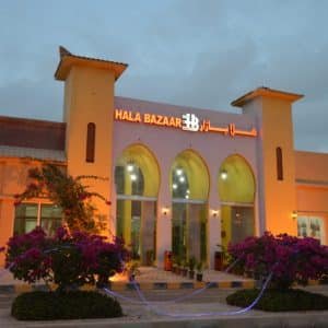 Hala Bazar Salalah with open-air market shops and coffee corners