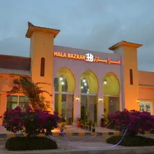 Hala Bazar Salalah with open-air market shops and coffee corners
