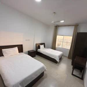 Homing Suites Salalah exterior and pool view